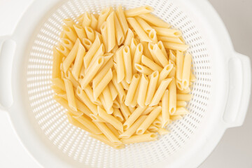 cooked pasta on white background
