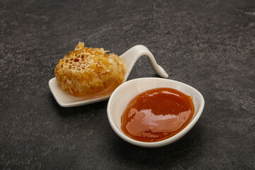 Natural honey in the bowl