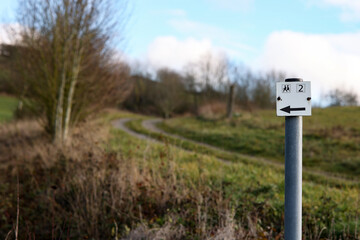 Road sign shows the way for hikers