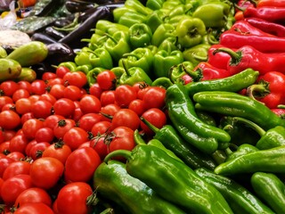 Grocery shopping. Grocer section. Tomato, pepper, cucumber, eggplant, zucchini.