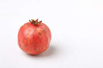 Fresh pomegranate fruit on white background