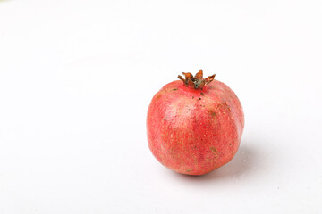 Fresh pomegranate fruit on white background