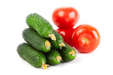 Fresh vegetables: cucumbers and  tomatoes isolated on white background macro close up. 