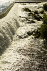 Fototapeta premium Frothy waterfall in backlite