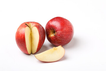 Red apple with slice on white background