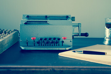 Mechanical calculator on a vintage desk. Accounting and auditing.