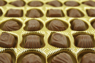 Chocolate candies set in an open box. Chocolate candy closeup.  Assorted chocolate sweets.  