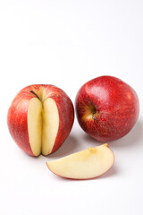 Red apple with slice on white background