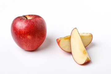 Naklejka na ściany i meble Red apple with slice on white background