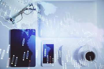 Multi exposure of financial chart hologram over desktop with phone. Top view. Mobile trade platform...