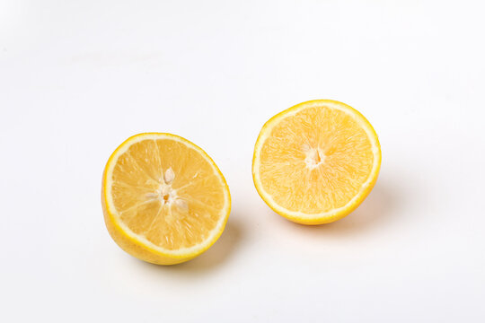 Fresh Half cut Orange or sweet lemon mosambi fruit on white background