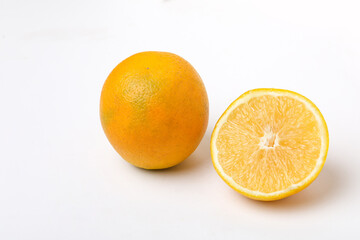 Obraz na płótnie Canvas Fresh Half cut sweet lemon or mosambi fruit on white background
