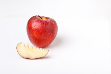 Fototapeta na wymiar Red apple with half and slice on white background