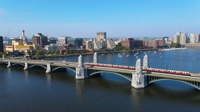 MBTA Red Line subway trains drive on Longfellow Bridge aerial view on Charles River between city of Cambridge and Boston, Massachusetts MA, USA.  