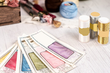 Threads in reels. Colored bobbins for embroidery knitting hobby accessories creativity.