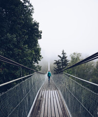 woman on suspension bridge