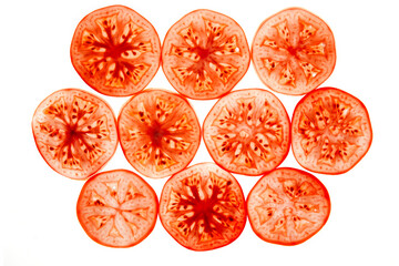 Fresh red tomatoes round pieces slices isolated on white background. 