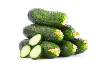 Fresh vegetables: green cucumbers whole and sliced isolated on white background macro close up. 