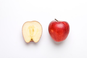 Red apple with slice on white background