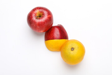 Stack of fresh fruits citrus slices, apple, orange or lemon. Colorful healthy fitness creative fun food concept. Mixed citrus fruit, apple isolated on white background