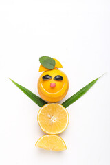 Orange or sweet lemon mosambi fruit cut in happy smile face shape on white background