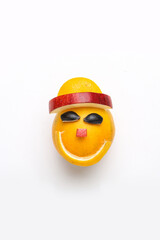 Orange or sweet lemon mosambi fruit cut in happy smile face shape on white background
