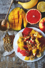 Healthy fruit salad with mango and seeds.