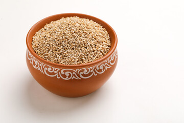 Sesame seed in bowl on white background