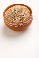 Sesame seed in bowl on white background