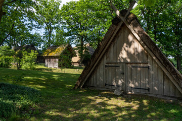 Fototapeta premium Characteristic stable for German moorland sheep with a straw roof in the natural preserve Lueneburger Heide
