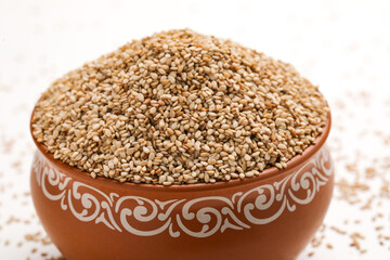Sesame seed in bowl on white background