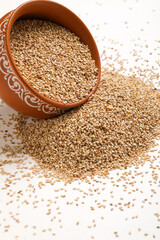 Sesame seed in bowl on white background
