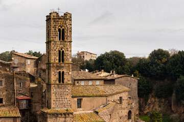 Fototapeta na wymiar Church tower in medieval italian town