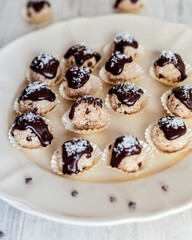 Coconut balls covered with dark chocolate