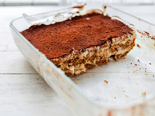 Italian tiramisu dessert on a porcelain plate. Vegan dessert