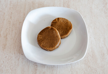 Seitan over white dish. Vegan food