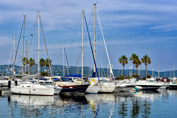 Port of Cavalaire-sur-Mer and palm trees in the background, commune in the Var department in the Provence-Alpes-C&ocirc;te d'Azur region in southeastern France.