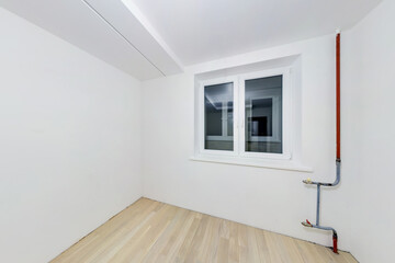 Empty unfurnished room with minimal preparatory repairs. interior with white walls