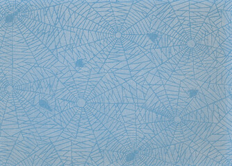 Old transparent spider paper on a blue background. Intermediate paper from a photo album. 
