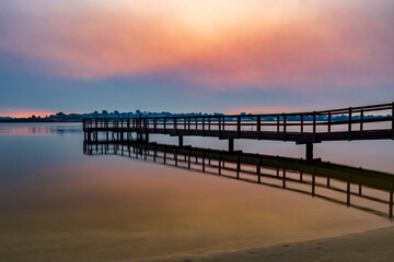 Fototapeta na wymiar Beautiful Smoky Jetty Sunset, Mirror Image Reflections, at Shelley, Perth, Western Australia