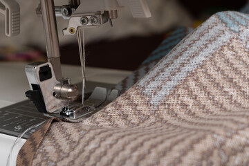 sewing bed linen on a sewing machine close-up