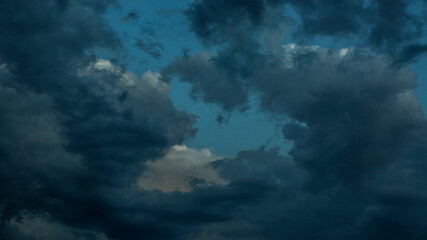 Naklejka na ściany i meble Dramatic sky with clouds at sunset