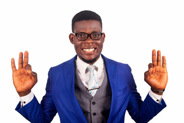 handsome young businessman doing okay gesture with fingers