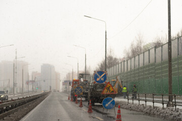 Blurry photo of road repairs.