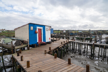 Naklejka premium view of the broken old docks and piers at Cais Palatifico on the Sado River Estuary