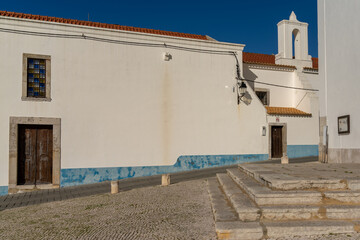 blue and white typical Portuguese buildings in the old town of Sines