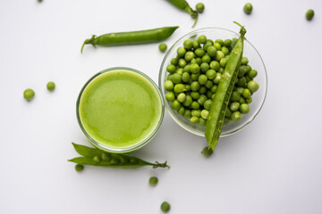 Healthy green peas juice or shake or beverage served in a glass