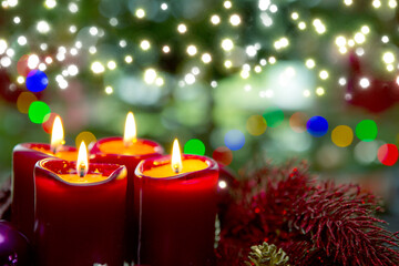 Four red candles for Advent. Christmas background.