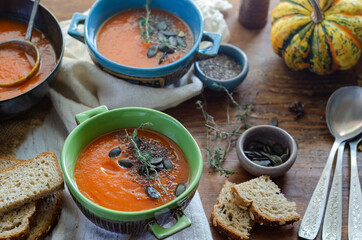 Pumpkin soup served  in bowl on the table