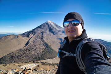 A beautiful shot of a male standing in Pico de Orizaba Volcano in Mexico